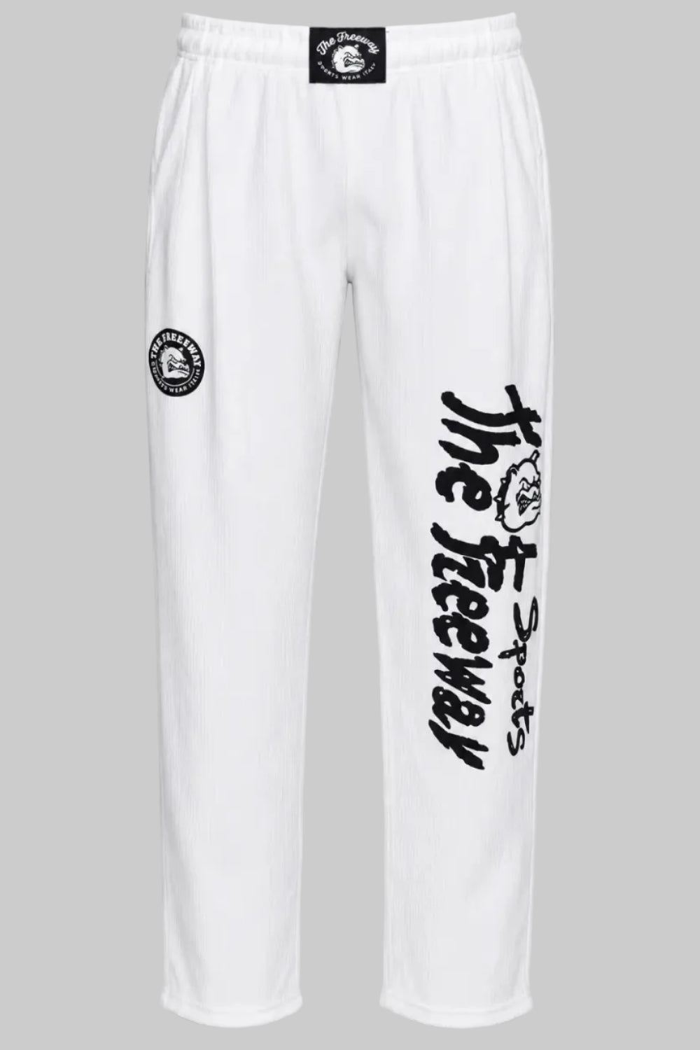 Unisex white bodybuilding training pants by Thefreeway Sportswear worn by a female model with matching hoodie, front view