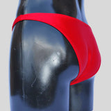 Thefreeway DN107 Competition Bodybuilding Briefs in red solid Lycra, side product view showing the competition cut