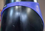 Thefreeway DN109 violet laminated competition bodybuilding posing trunks, close-up side detail showing the narrow waistband and logo