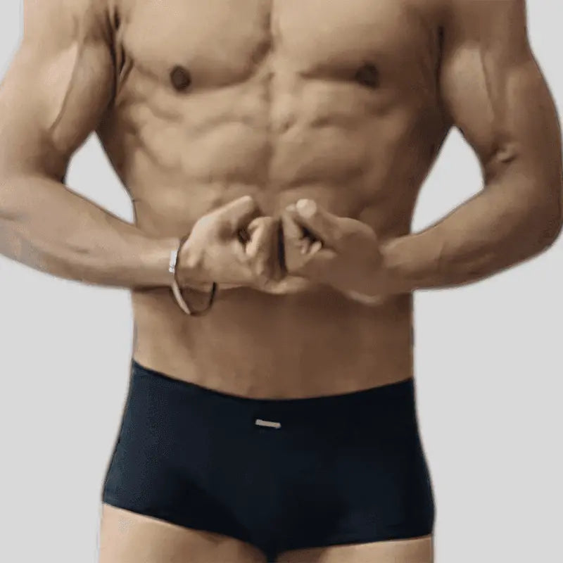 Thefreeway Art.111 Men's Classic Bodybuilder Shorts in black Lycra worn by a male bodybuilder, front view