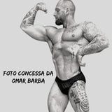 Thefreeway Men's Classic Physique Competition Posing Trunks in black Lycra worn by a male bodybuilder in a side flex pose