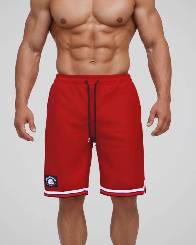 Men's red basketball shorts Thefreeway Sportswear art. 1503 worn by a bodybuilder, close-up front view