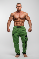 Thefreeway Art.253 unisex bodybuilding training pants in fluo green and black stripes, front studio pose worn by a male bodybuilder