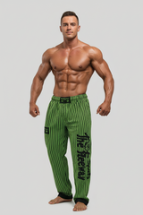 Thefreeway Art.253 unisex bodybuilding training pants in fluo green and black stripes, full-body studio view worn by a male bodybuilder