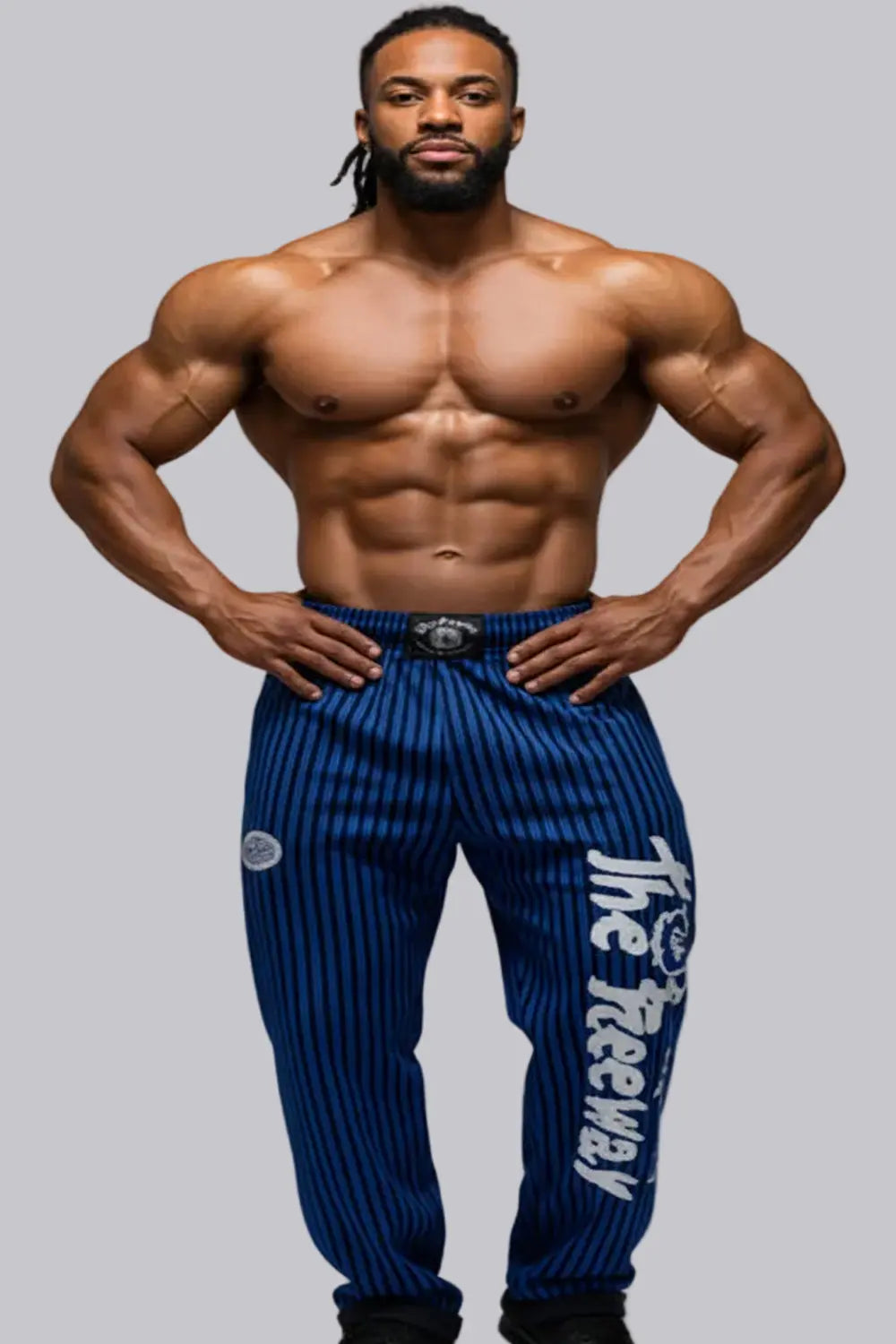 Thefreeway Art.253 unisex bodybuilding training pants in royal blue and black stripes, front view worn by a male bodybuilder