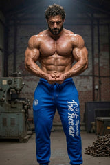 Thefreeway Art.254 unisex bodybuilding training pants in sky blue and black stripes worn by a male bodybuilder in a front most muscular pose