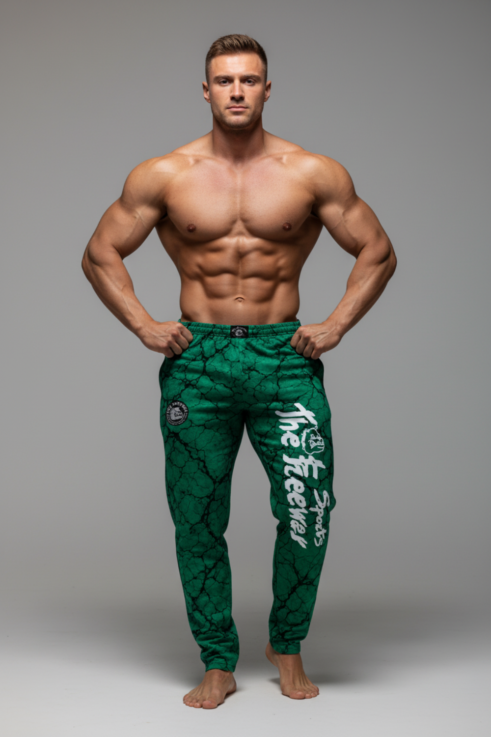 Unisex green marbled bodybuilding training pants Thefreeway Sportswear art. 252 worn by a bodybuilder, front view with white leg logo