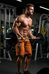 Unisex mustard marbled bodybuilding shorts by Thefreeway Sportswear worn during a barbell workout in the gym