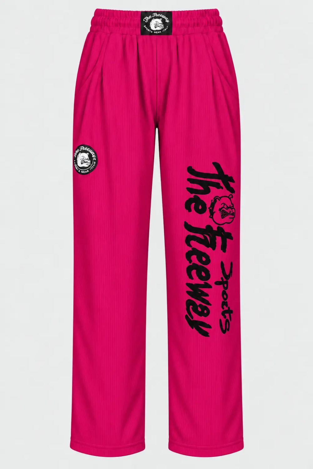 Thefreeway unisex training pants in fuchsia worn by a female model, full-body 