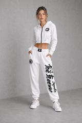 Unisex white bodybuilding training pants by Thefreeway Sportswear worn by a female model with matching hoodie, front view