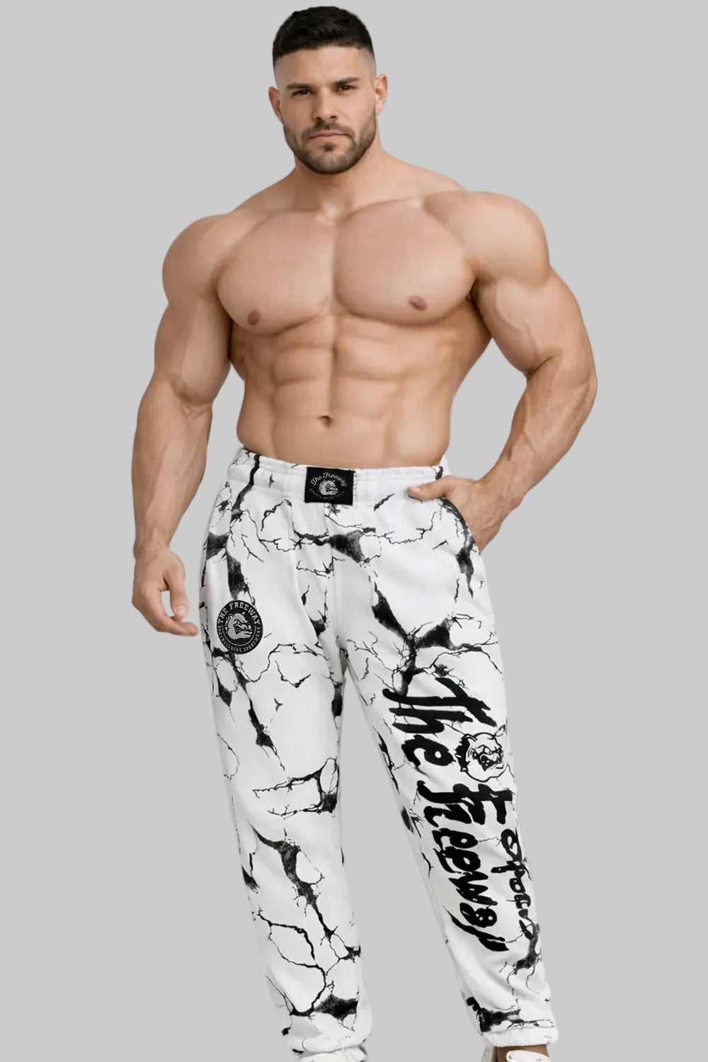 Unisex white marbled bodybuilding training pants Thefreeway Sportswear art. 252 worn by a bodybuilder, front view with black leg logo