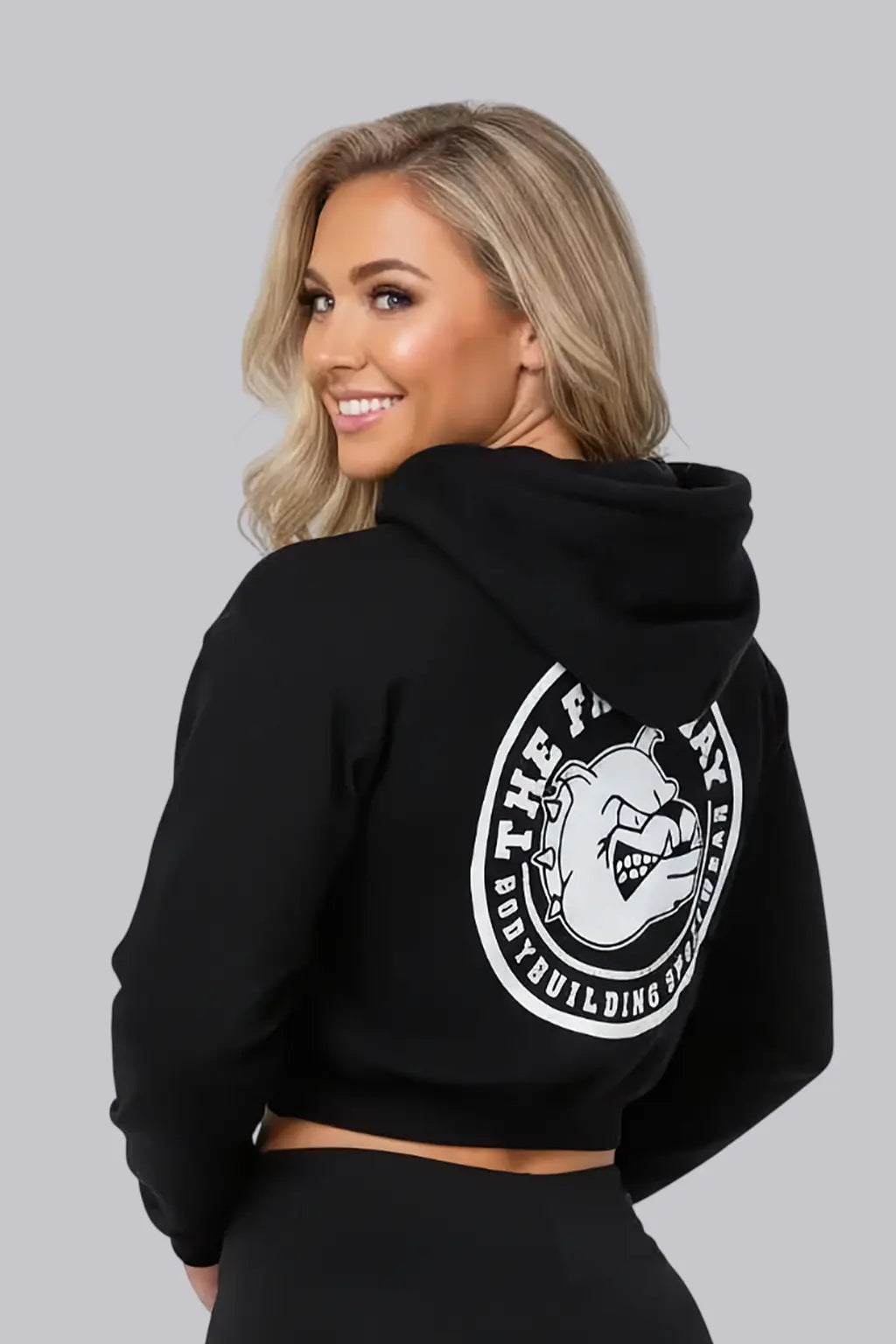Thefreeway Art.6586 women's hooded jacket in black worn by a female model, three-quarter back view showing the large rear logo