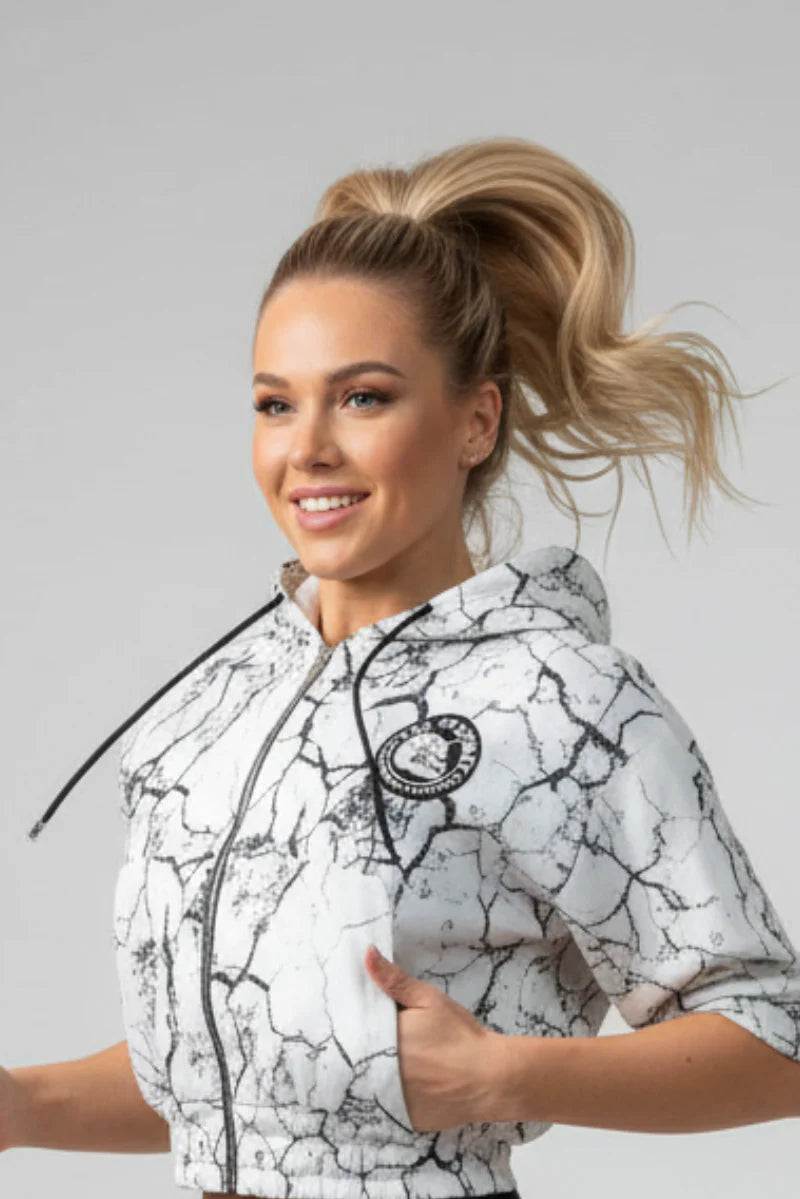 Thefreeway Art.6586 women's hooded jacket in marbled white worn by a female model, three-quarter front view
