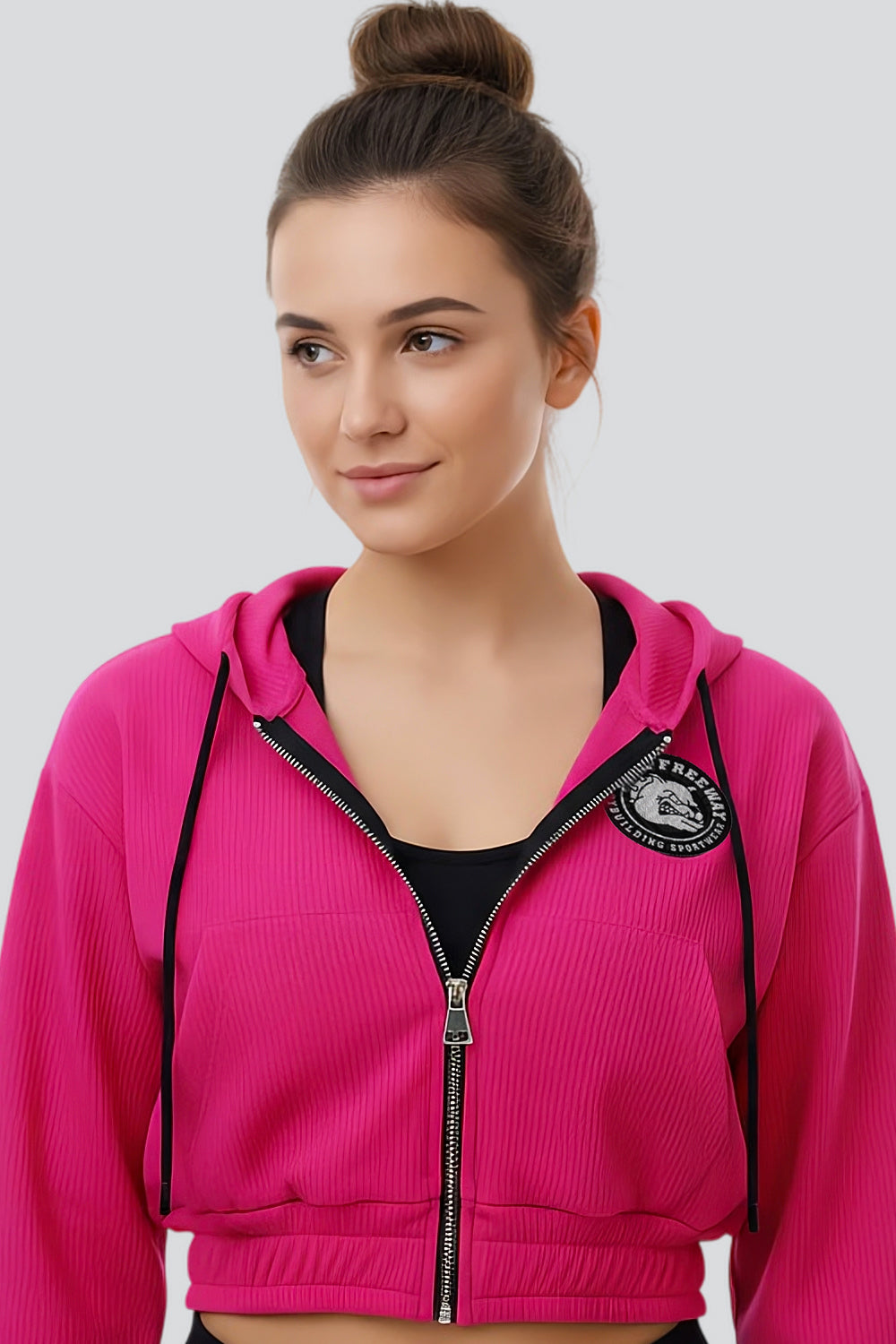 Thefreeway Art.7870 women's fuchsia training suit hooded jacket worn by a female model, front view showing the chest logo